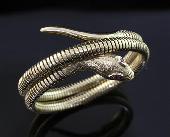 An early 1960s Victorian style 9ct gold coiled serpent bracelet, gross 30.7 grams.